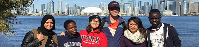 Students standing in group with Toronto skyline in the background